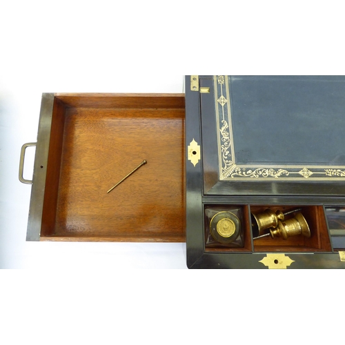 368 - A late Victorian coromandel brass inlaid, military design writing slope with hinged lid, enclosing a... 