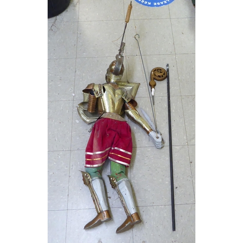 369 - A wooden and metal puppet, fashioned as a knight  38