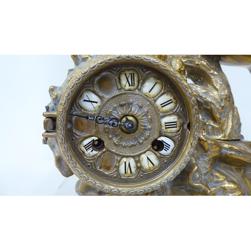 370 - A cast brass mantel clock, fashioned as a rearing horse; the 8 day movement faced by a Roman dial  2... 