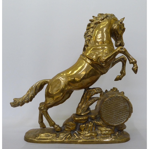 370 - A cast brass mantel clock, fashioned as a rearing horse; the 8 day movement faced by a Roman dial  2... 