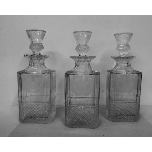 373 - A set of three lead crystal, thistle design decanters and stoppers, each with cut decoration  larges... 