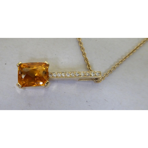 377 - A 14ct gold citrine and diamond pendant