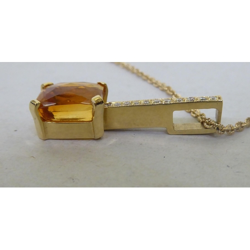 377 - A 14ct gold citrine and diamond pendant