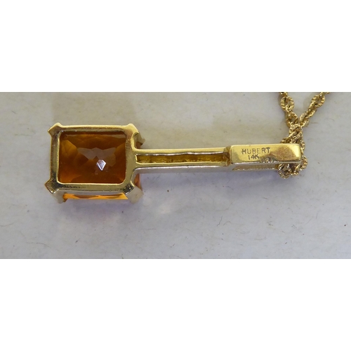 377 - A 14ct gold citrine and diamond pendant