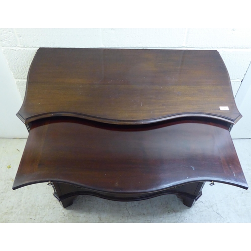 38 - An Edwardian Georgian design, serpentine front, mahogany dressing chest with four long drawers and b... 