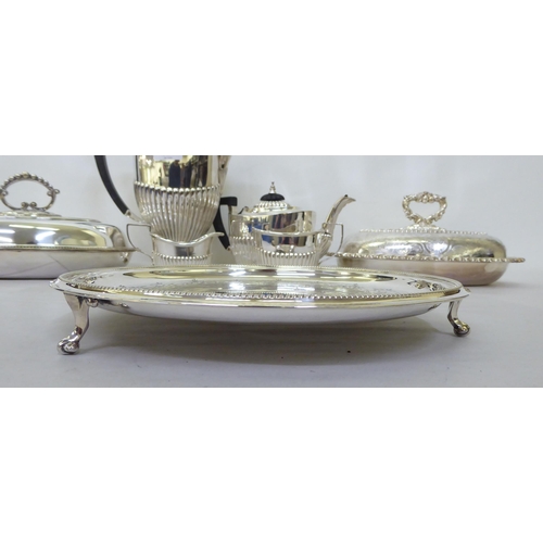 384 - Silver plate: to include a four piece tea set of oval, demi-reeded form