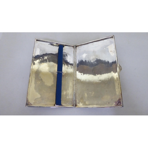 388 - A silver cigarette case with an engine turned, hinged body  Chester 1914  (approx. weight ... 