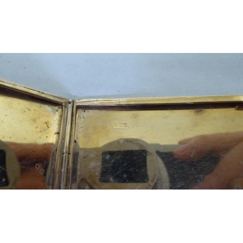 389 - A 9ct gold cigarette case with an engine turned, hinged body  (approx. 107 grams)