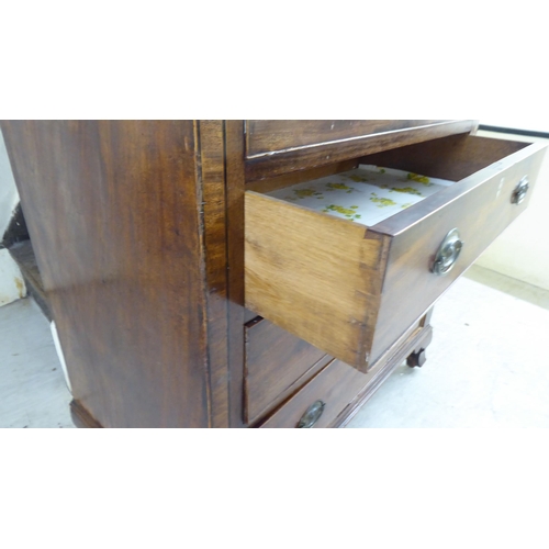 41 - An early 19thC mahogany cabinet with a hinged lid, over a facsimile drawer and three drawers, raised... 