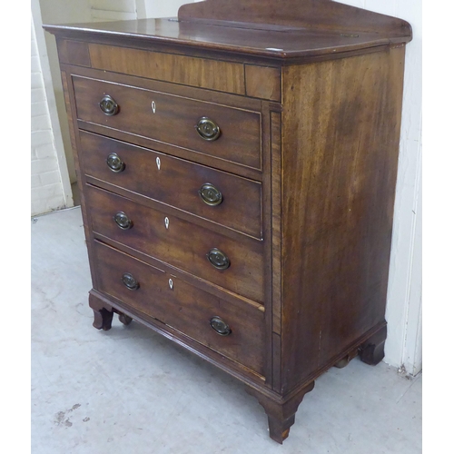 41 - An early 19thC mahogany cabinet with a hinged lid, over a facsimile drawer and three drawers, raised... 