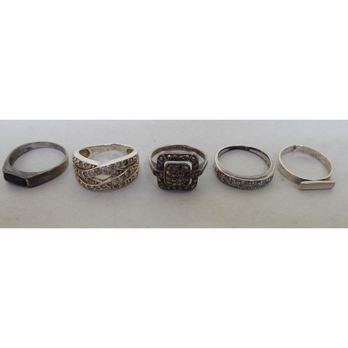 44 - Silver white metal rings  various settings and styles; and four white metal pill boxes