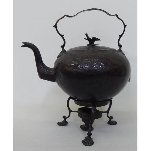 47 - Four items of Arts of Crafts and later metalware: to include a bronze finished teapot on stand