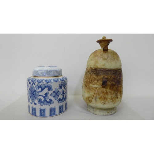 61 - Oriental collectables: to include a porcelain tea caddy, decorated with blue and white flora  7... 