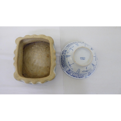 61 - Oriental collectables: to include a porcelain tea caddy, decorated with blue and white flora  7... 