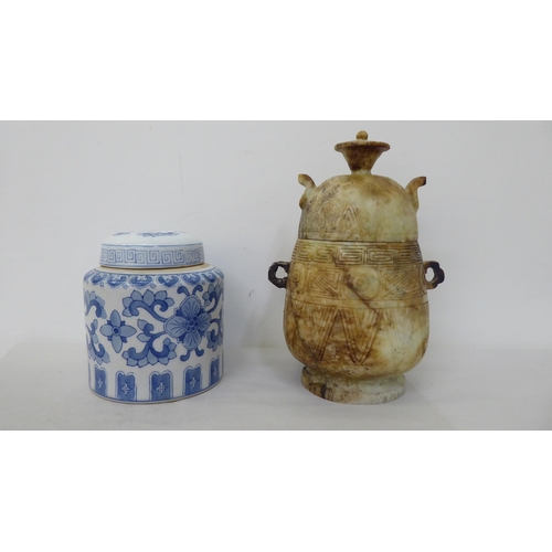 61 - Oriental collectables: to include a porcelain tea caddy, decorated with blue and white flora  7... 