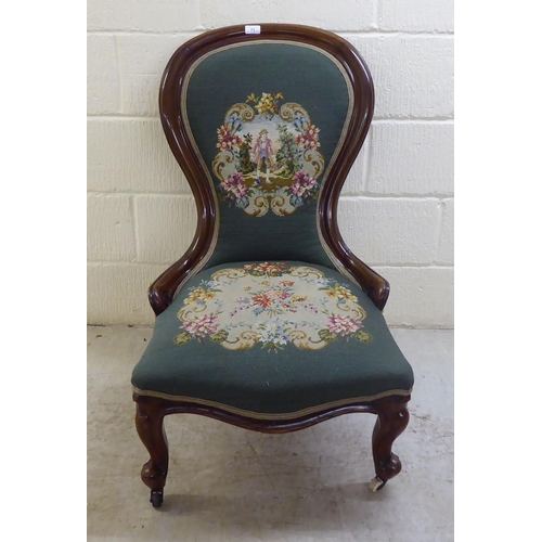 71 - WITHDRAWN A late Victorian walnut framed spoon back salon chair with a tapestry upholstered back and... 