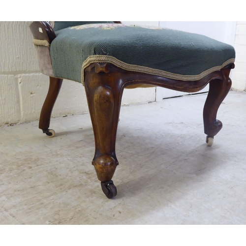 71 - WITHDRAWN A late Victorian walnut framed spoon back salon chair with a tapestry upholstered back and... 