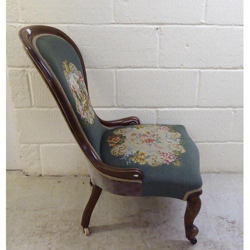 71 - WITHDRAWN A late Victorian walnut framed spoon back salon chair with a tapestry upholstered back and... 