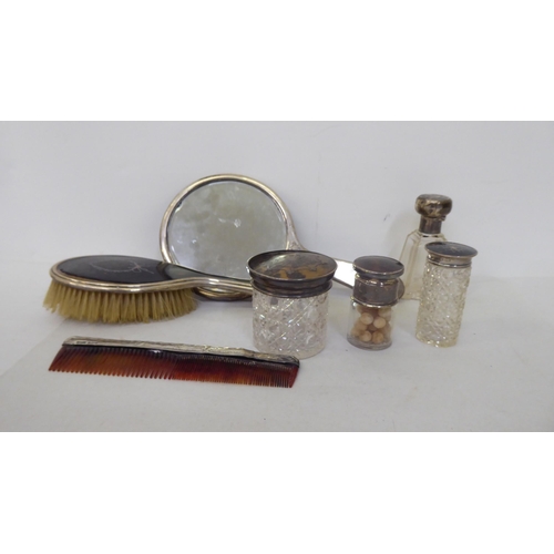 76 - Silver and tortoiseshell dressing table accessories: to include a handmirror  Birmingham 1919