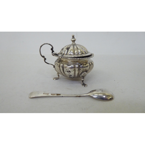 81 - Silver collectables: to include a pepper pot of demi ribbed form, on pad feet  Birmingham 1903