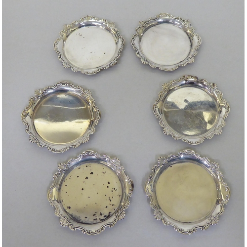 89 - A set of six silver coloured metal wine glasses and coasters  stamped Sterling 950  (approx. 6ozs)