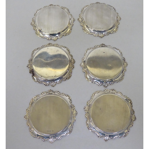 89 - A set of six silver coloured metal wine glasses and coasters  stamped Sterling 950  (approx. 6ozs)