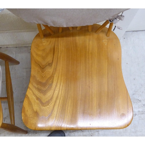 90 - An Ercol light elm drop-leaf dining table, raised on square, tapered legs  30