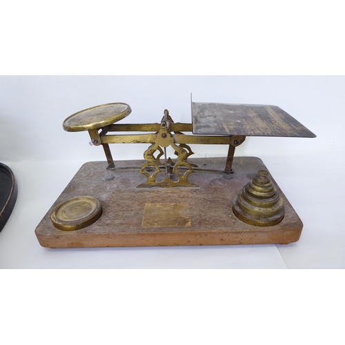 224 - 20thC metalware: to include a set of early 20thC cast iron scales with brass weighing trays and atte... 