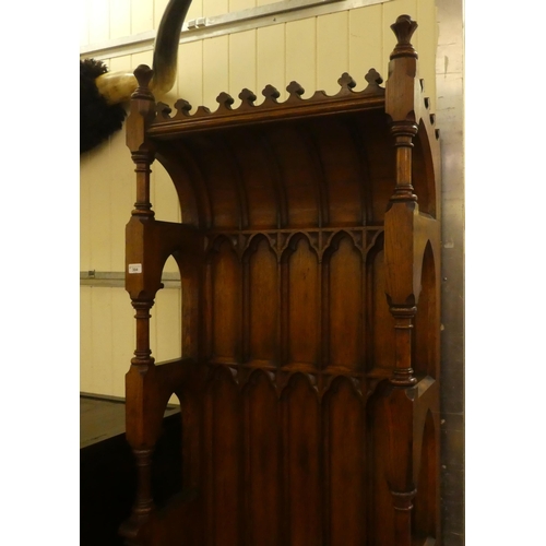 304 - A late Victorian honey coloured oak, Bishop's throne with a high, canopied back with Gothic tracery ... 