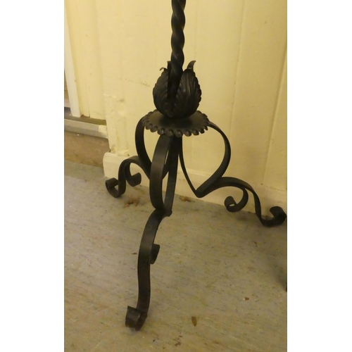 315 - A late 19thC blackened steel, freestanding bell, in an ornately cast frame, on a barleytwist stem an... 