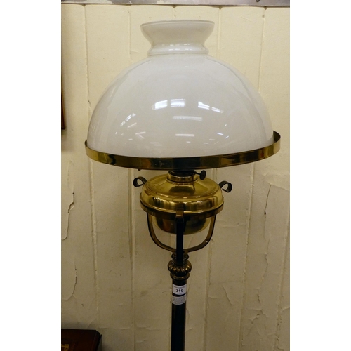 319 - A late Victorian brass finished lamp standard, the reservoir supported by a tubular column, converte... 