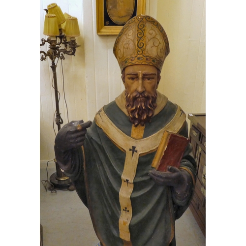 323 - A late 19th/early 20thC painted plaster standing figure, a saint, possibly Patrick  53