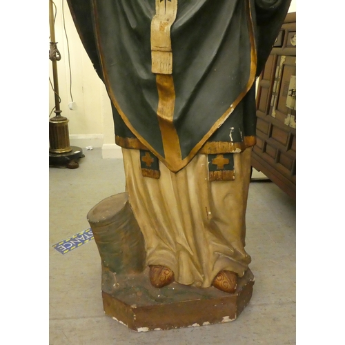 323 - A late 19th/early 20thC painted plaster standing figure, a saint, possibly Patrick  53