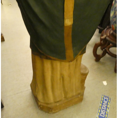 323 - A late 19th/early 20thC painted plaster standing figure, a saint, possibly Patrick  53