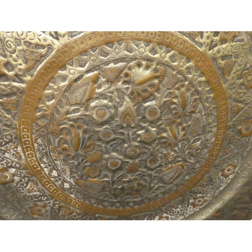 331 - A mid 20thC Persian copper and white metal finished tray, decorated with floral motifs  35