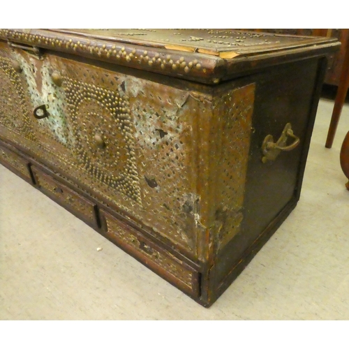 348 - An Asian hardwood chest with profusely applied and rivetted brass ornament with straight sides, a hi... 