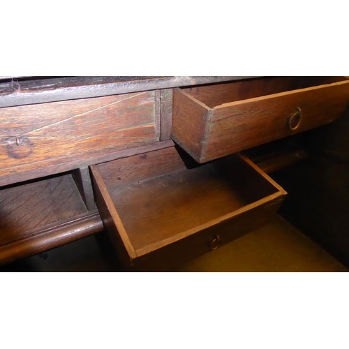 351 - An early 19thC oak scribes, twin handled desk with thumb and chip carved ornament and a trailing flo... 