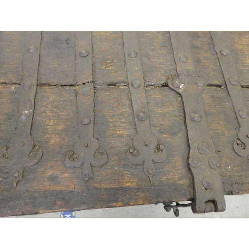 353 - A 17thC low Country oak boarded chest, extensively rivetted iron strapwork, studs and hinges, a clas... 