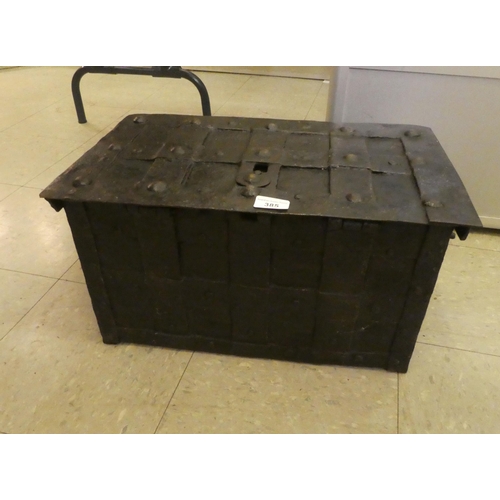 385 - An 18thC cast iron strong box with a hinged lid  11