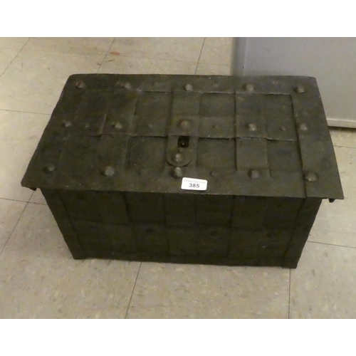 385 - An 18thC cast iron strong box with a hinged lid  11