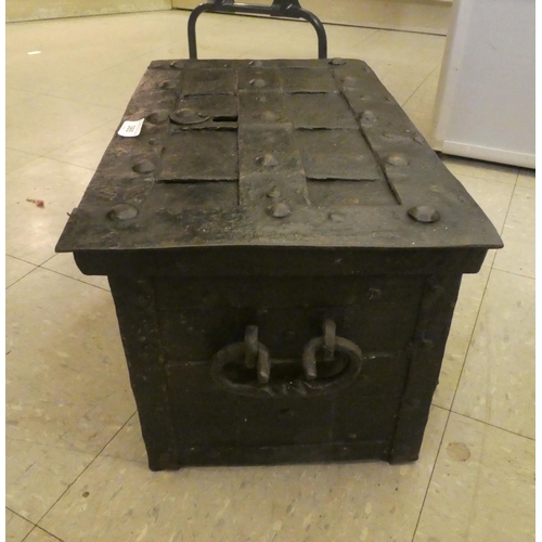 385 - An 18thC cast iron strong box with a hinged lid  11