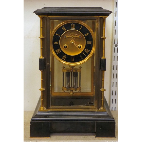 142 - A late Victorian four glass and black slate cased mantel clock with bevelled panels, integral, outse... 