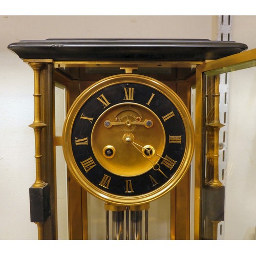 142 - A late Victorian four glass and black slate cased mantel clock with bevelled panels, integral, outse... 