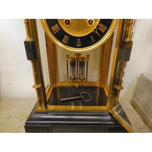 142 - A late Victorian four glass and black slate cased mantel clock with bevelled panels, integral, outse... 