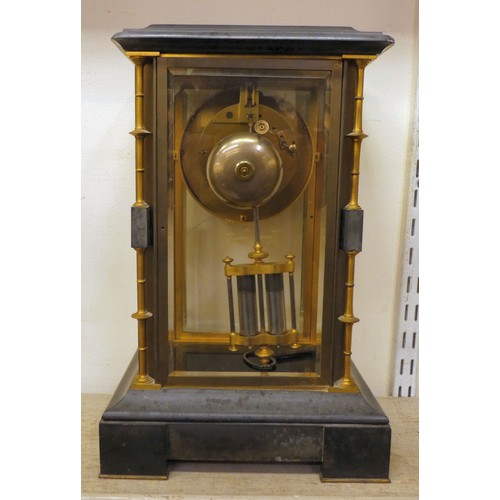 142 - A late Victorian four glass and black slate cased mantel clock with bevelled panels, integral, outse... 