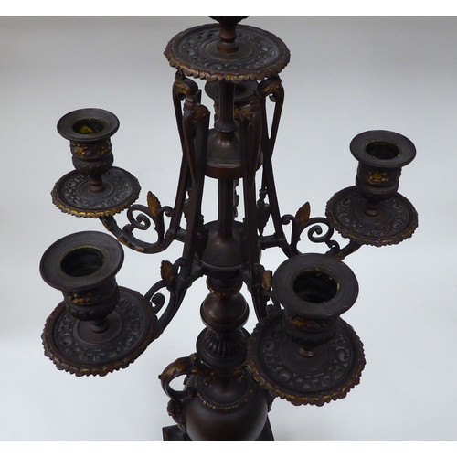 354 - A modern bronze finished metal, five branch candelabra of urn design with a marble plinth  31