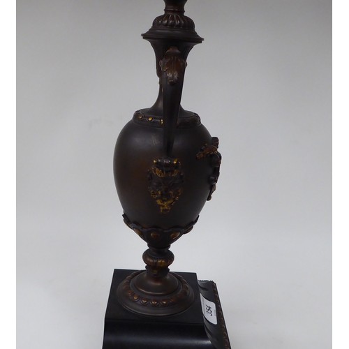 354 - A modern bronze finished metal, five branch candelabra of urn design with a marble plinth  31