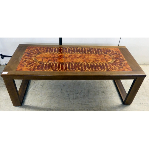 104 - A 1970s teak framed and pottery tile top coffee table, raised on square legs  17