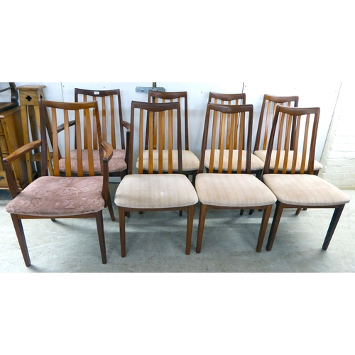 105 - A set of eight G-Plan teak framed dining chairs with upholstered seats, raised on square, tapered le... 