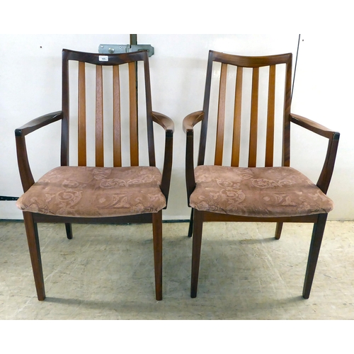 105 - A set of eight G-Plan teak framed dining chairs with upholstered seats, raised on square, tapered le... 